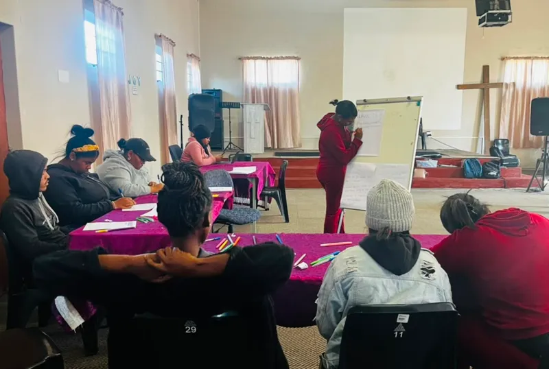 A YouthTable community workshop with participants seated around tables