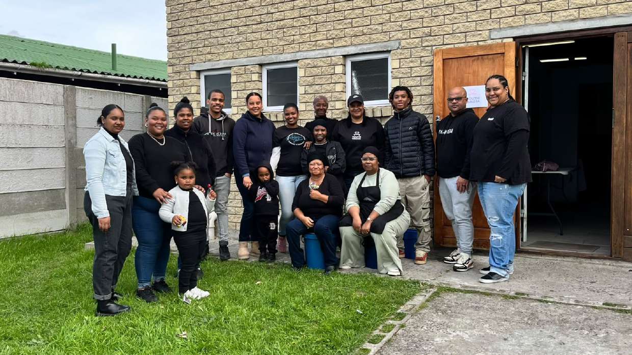 The YouthTable S.A. team standing together outside their church